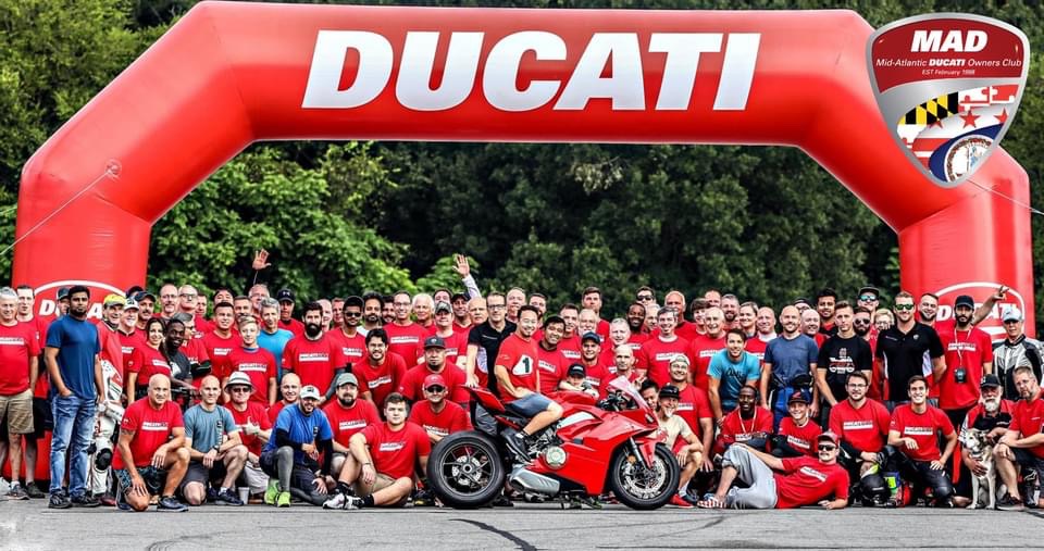 MAD members under the Ducati arch